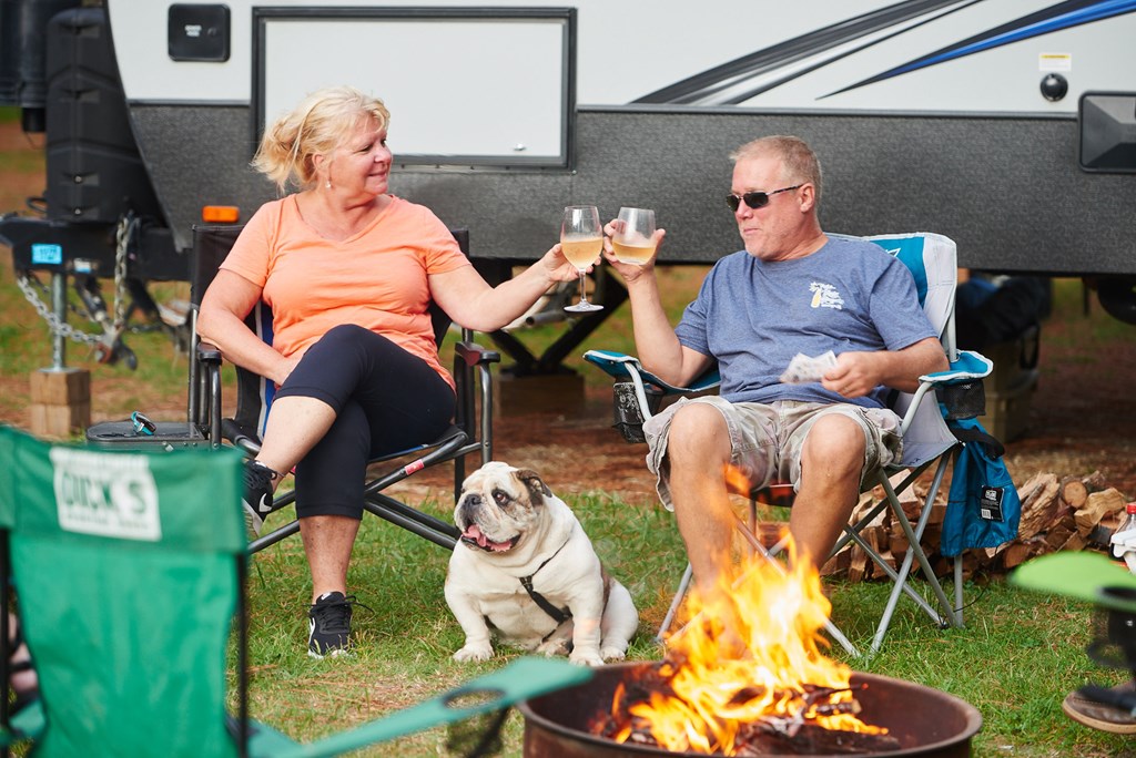 couple camping with dog